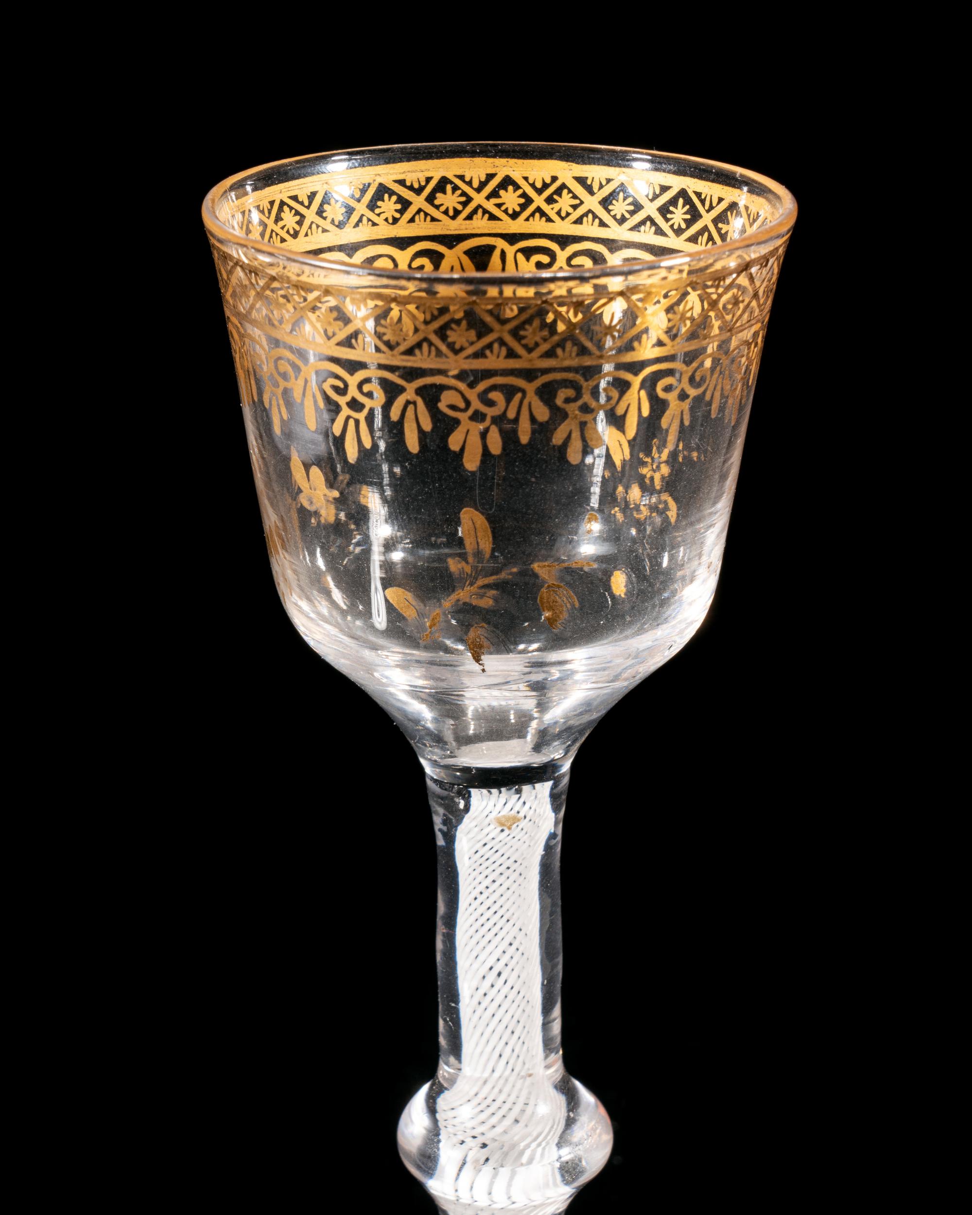 A Giles Gilt Decorated Opaque Twist Knopped Wine Glass