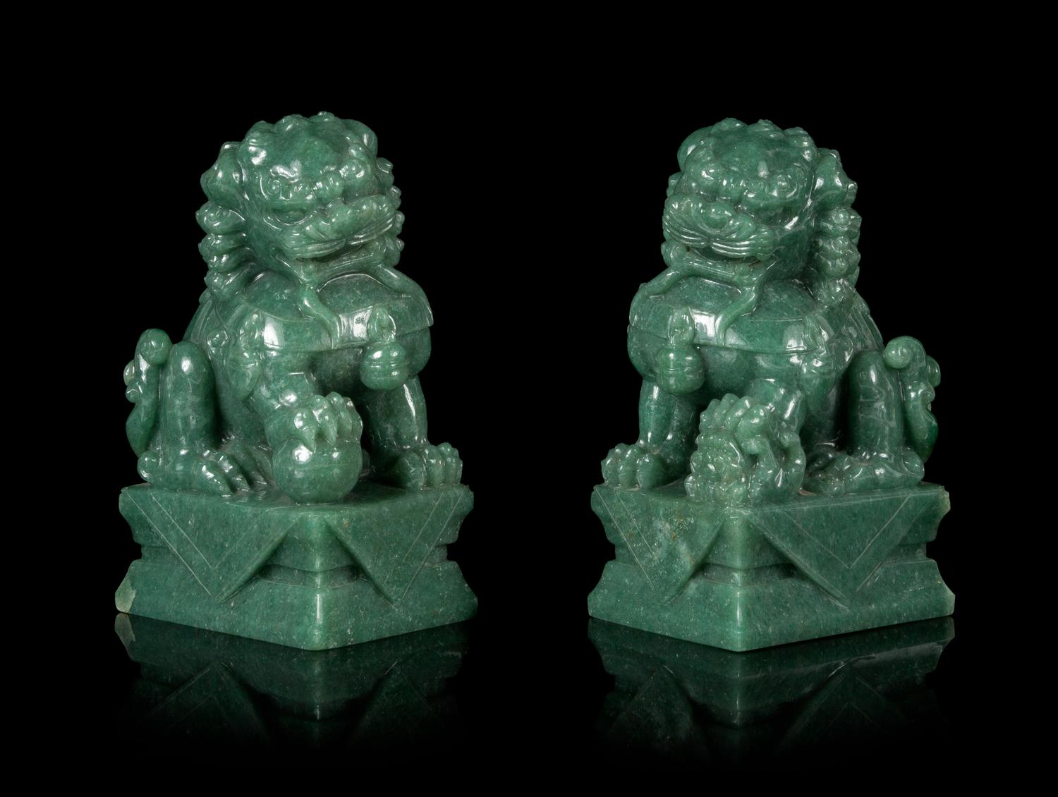 A Pair of Chinese Green Jade Figures of Fu Lions Height 6 1/4 inches. — 20TH CENTURY