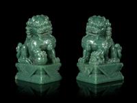 A Pair of Chinese Green Jade Figures of Fu Lions Height 6 1/4 inches. — 20TH CENTURY