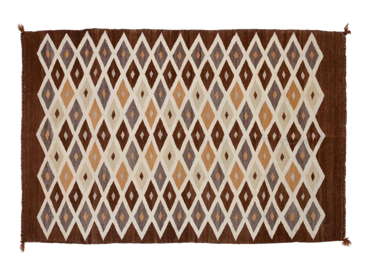 Group of Four Regional Navajo Rugs