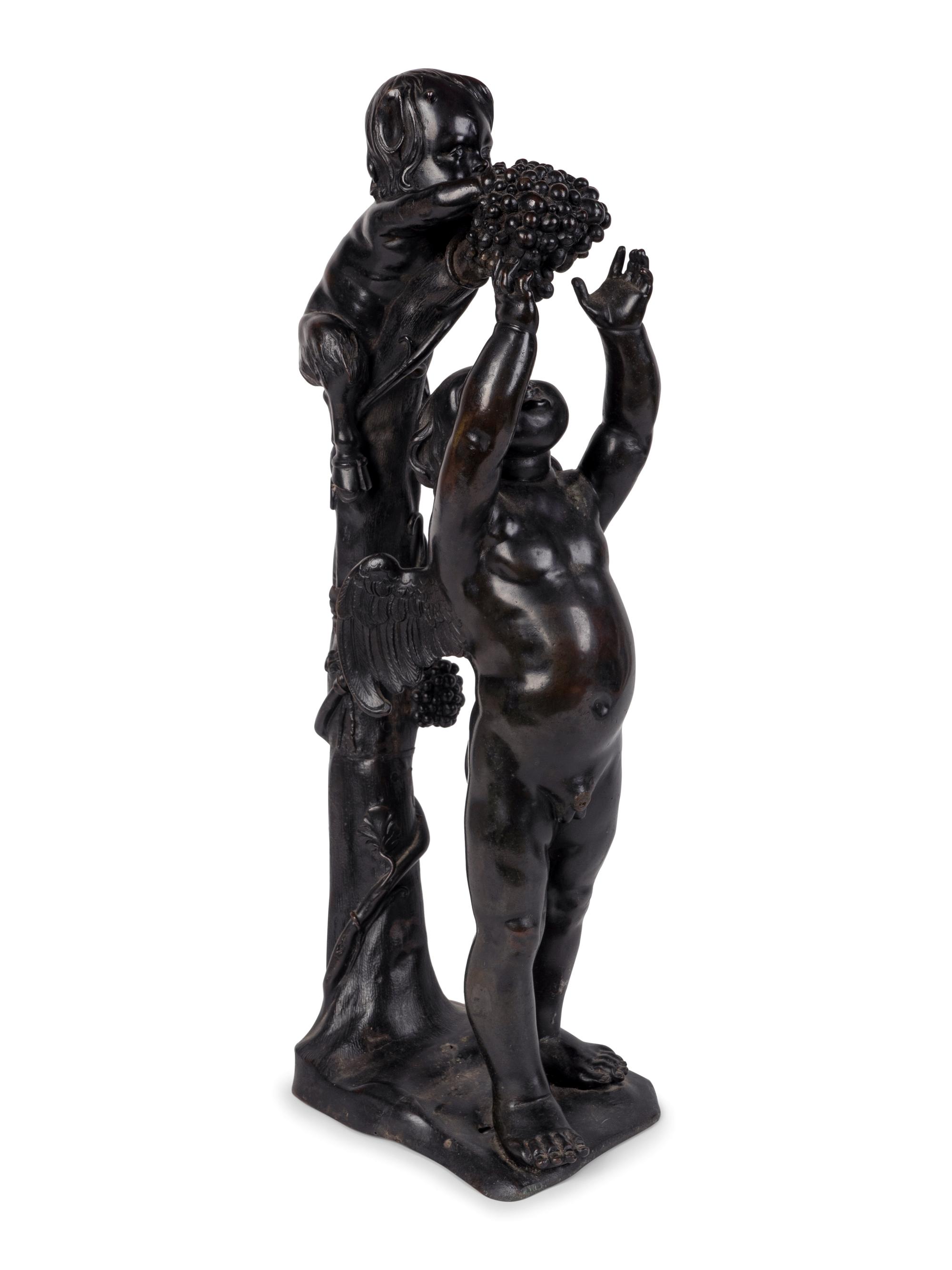 A Continental Patinated Bronze Group of Cupid and an Infant Satyr — CIRCA 1900
