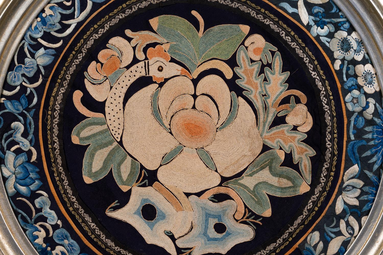 A Chinese Framed Blue Ground Embroidered Silk Panel Diameter 13 1/2 inches.