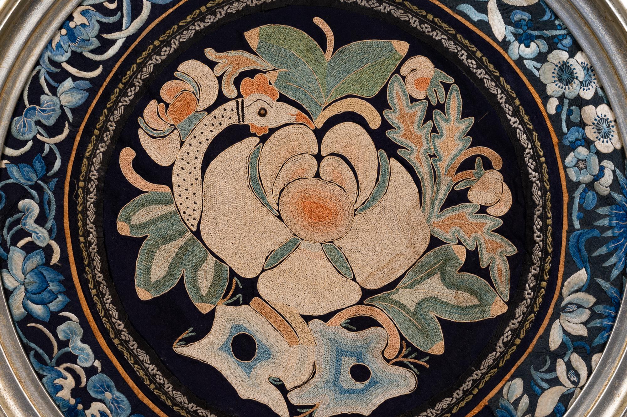 A Chinese Framed Blue Ground Embroidered Silk Panel Diameter 13 1/2 inches.