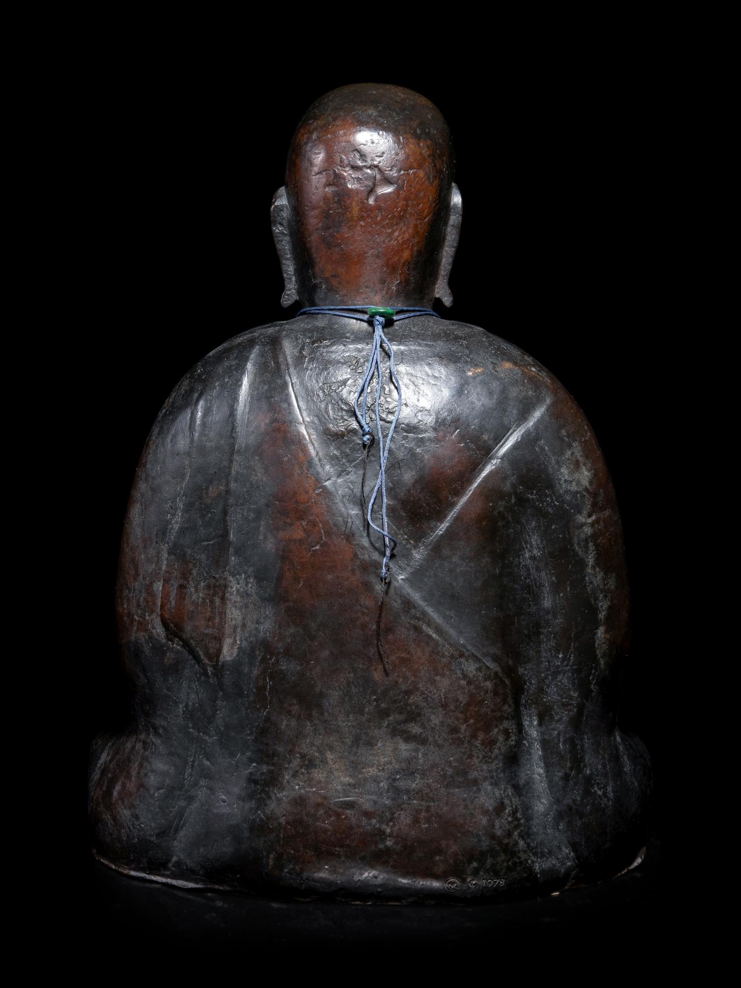 A Chinese Bronze Figure of a Monk