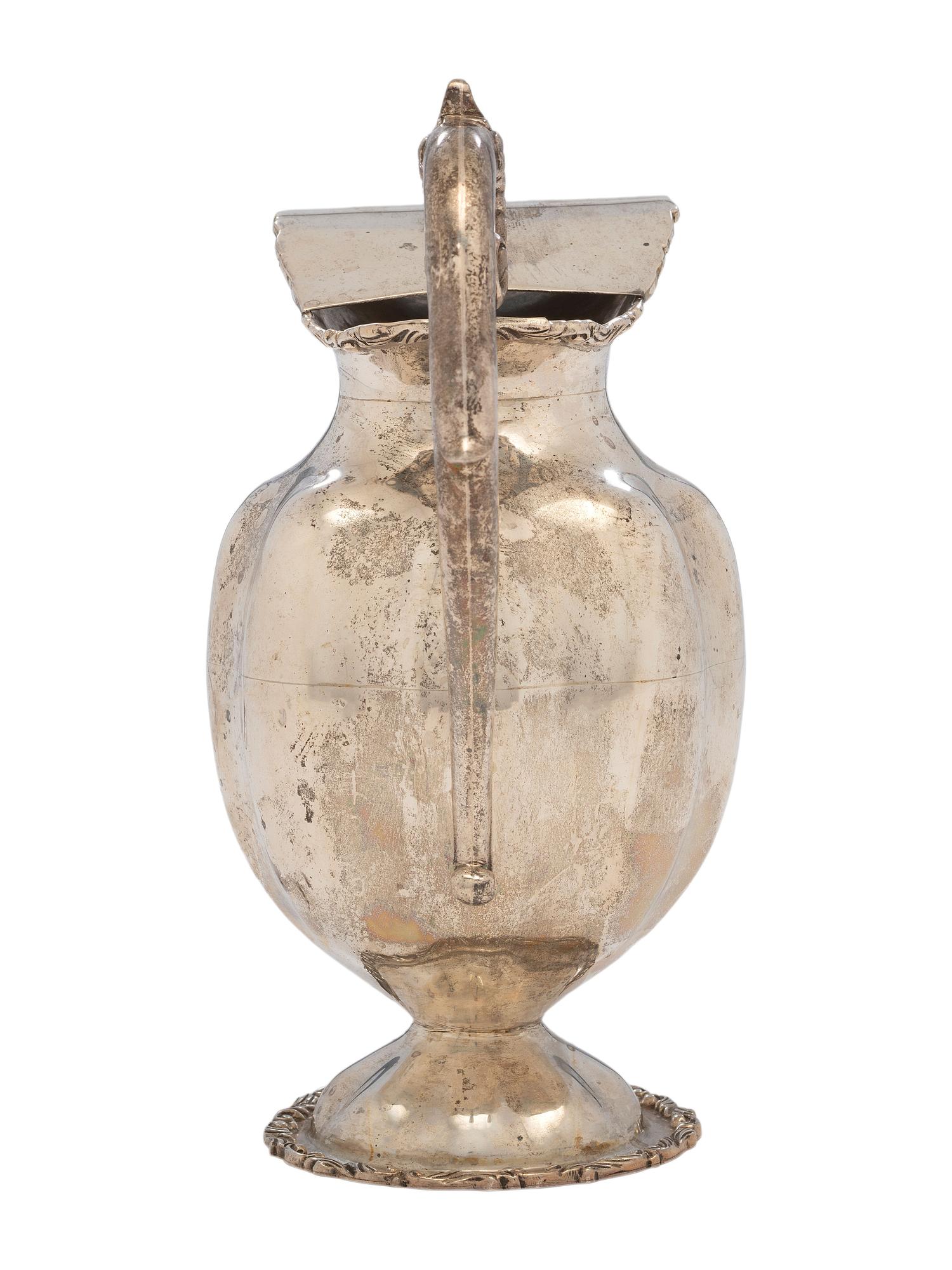 A Silver Water Pitcher