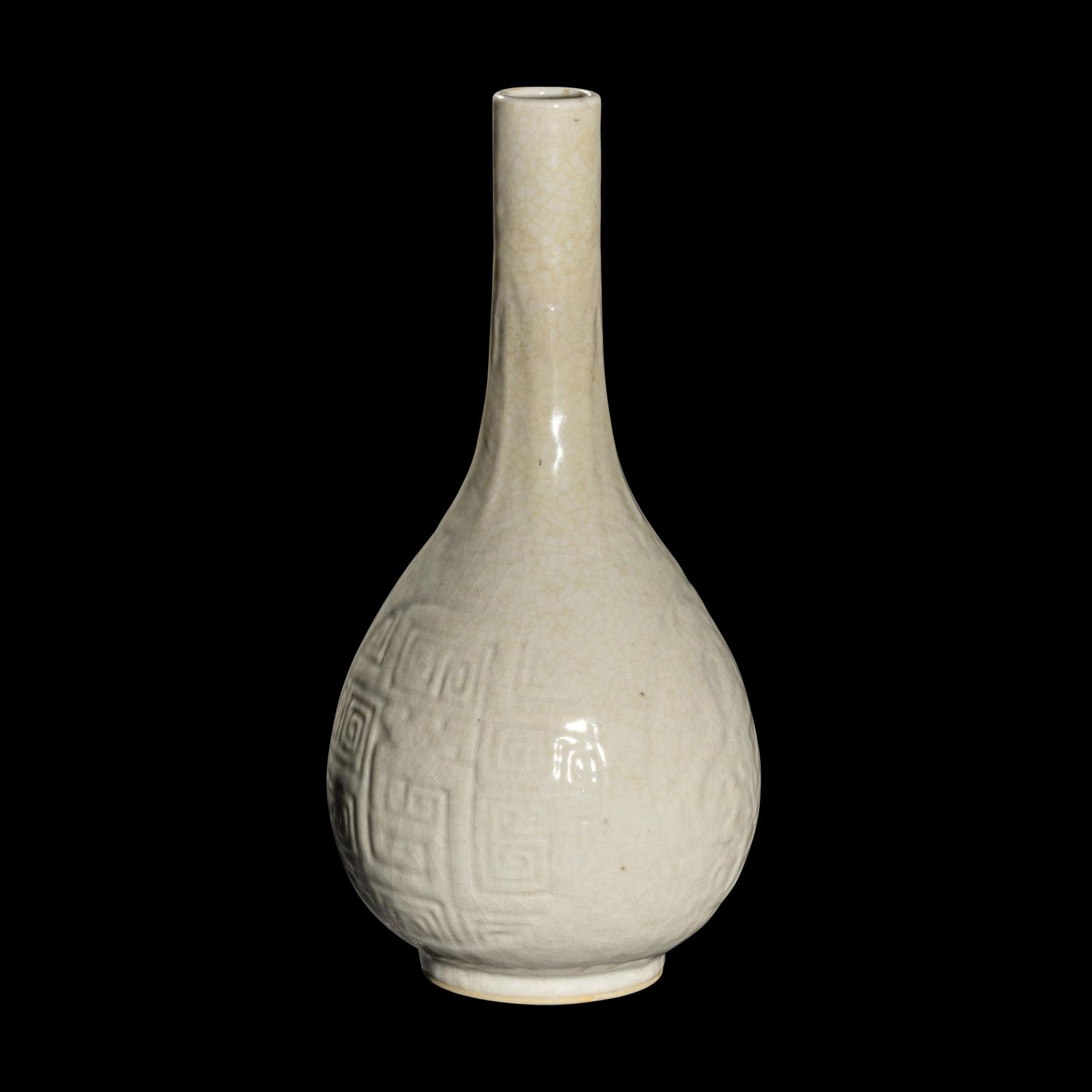 A Chinese Molded White Glazed Porcelain Bottle Vase, 18th/19th Century 清中期 白釉模印如意纹膽瓶