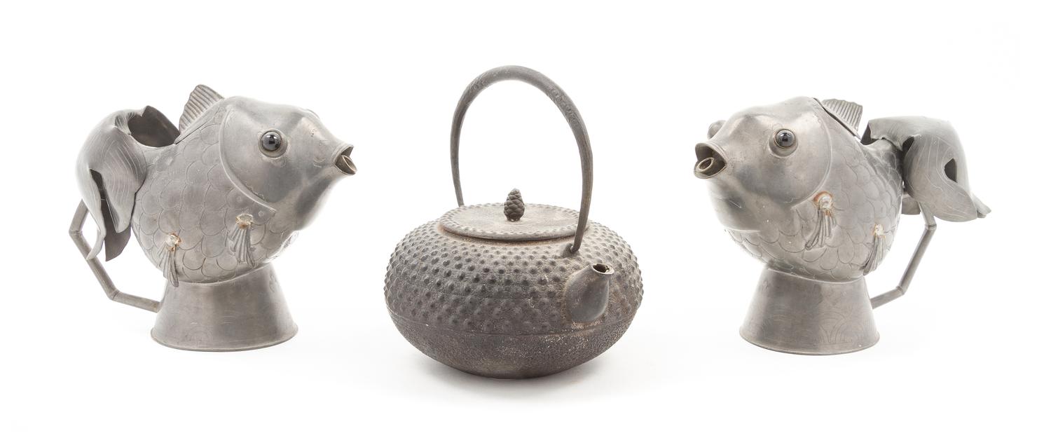 A Pair of Chinese Pewter Fish Form Ewers Height of largest 3 1/4 x diameter 6 inches.