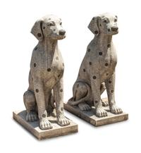 A Pair of Carved Granite and Black Marble Inlaid Seated Dogs