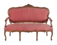 A Louis XV Style Carved Walnut Canapé