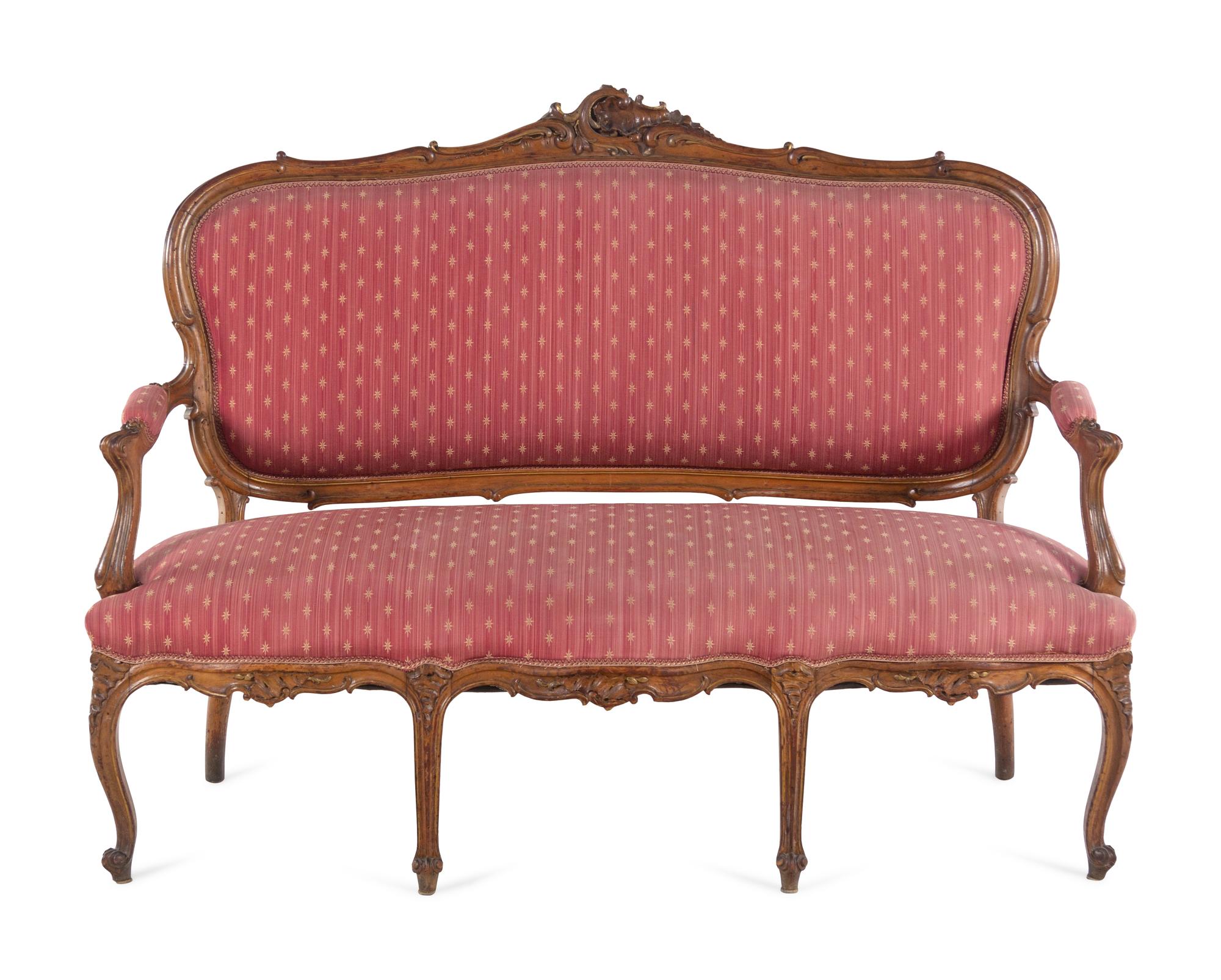 A Louis XV Style Carved Walnut Canapé