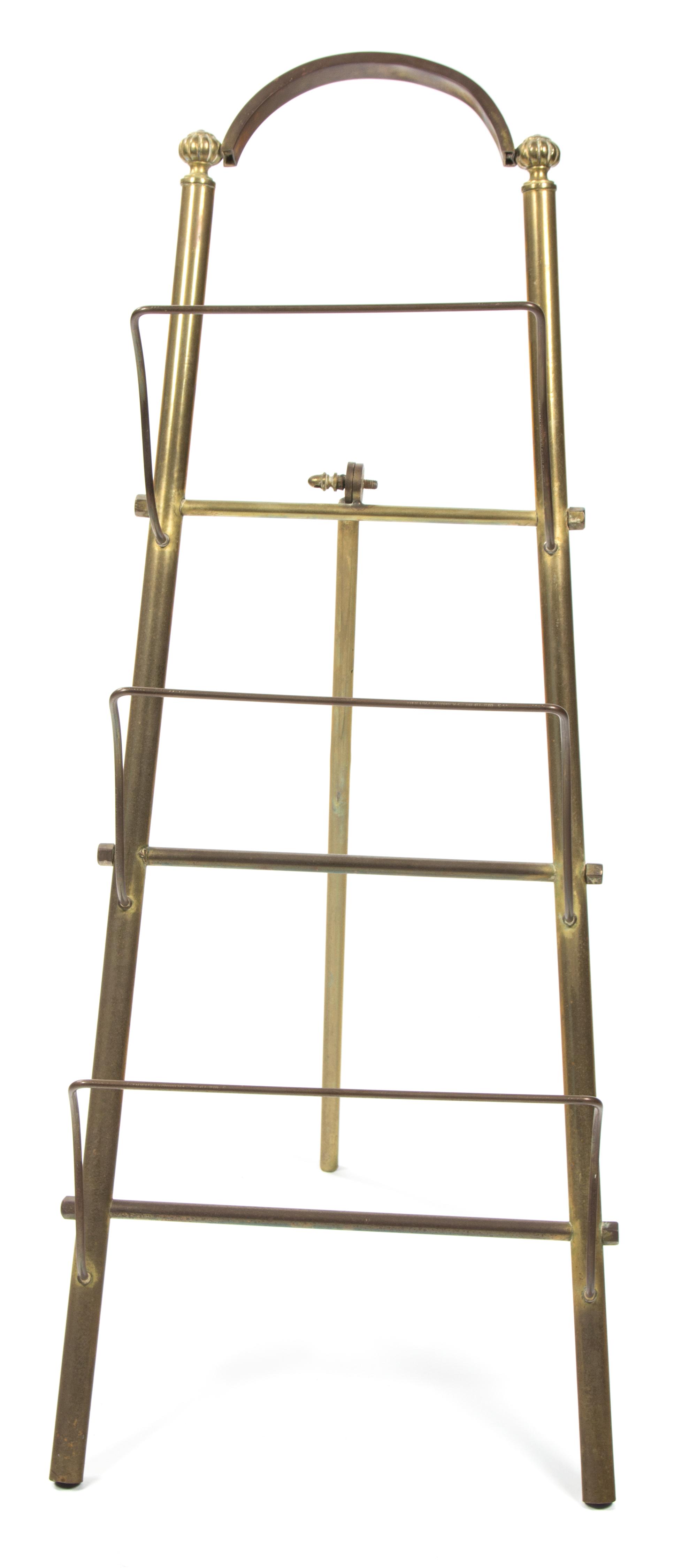 A Brass Magazine Rack Height 28 1/4 inches. — 20TH CENTURY