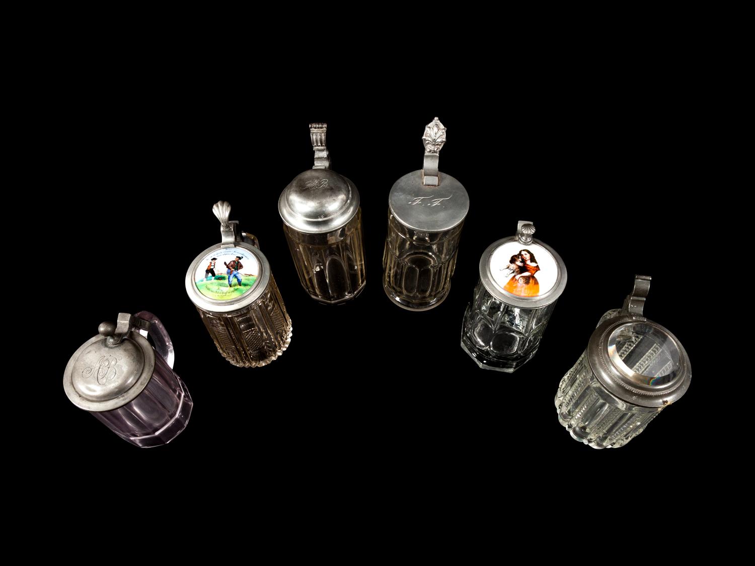 A Collection of Steins and a Large Pitcher