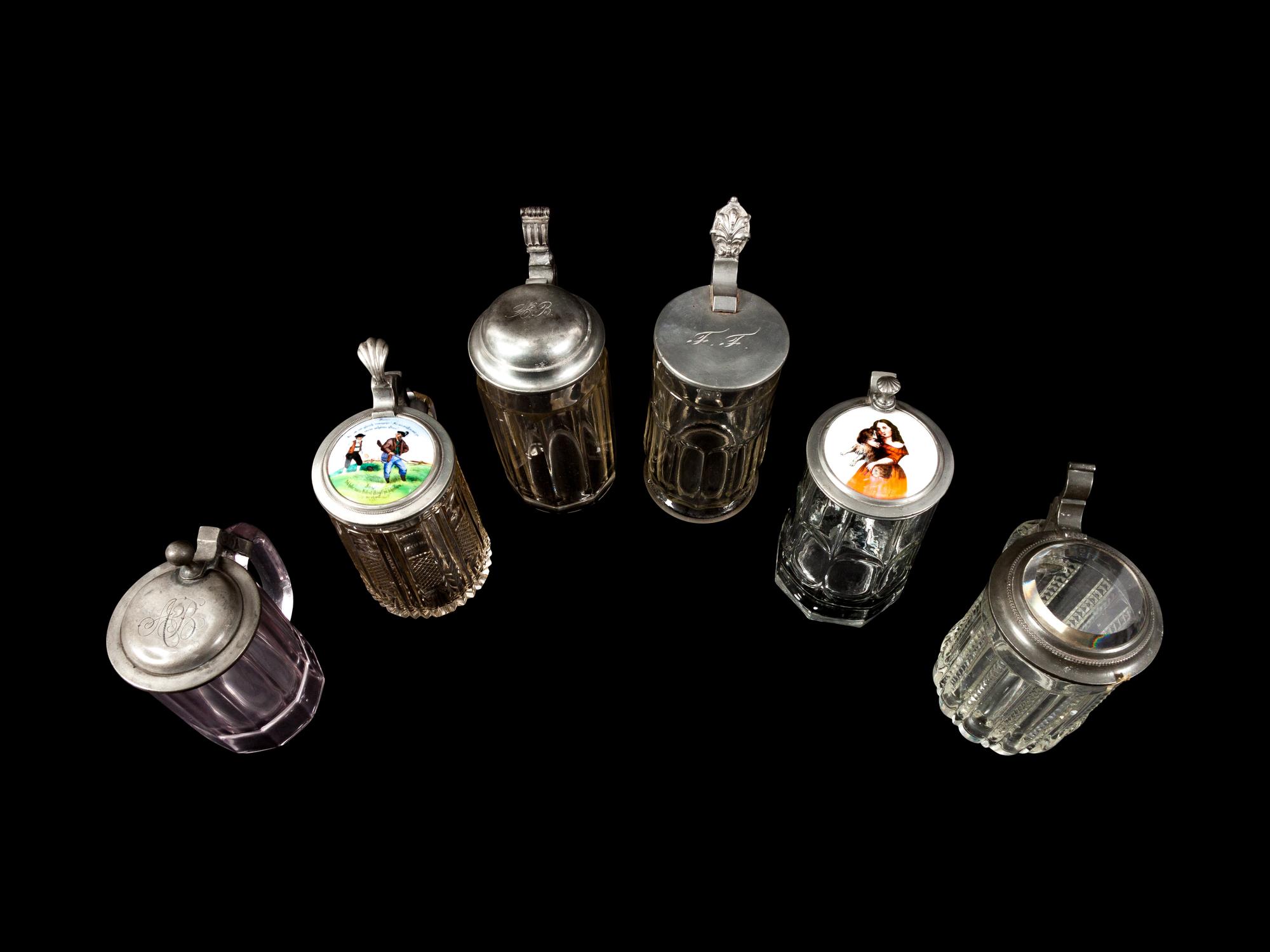 A Collection of Steins and a Large Pitcher