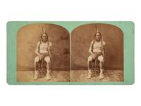 [NATIVE AMERICANS]. MORROW, Stanley J. (1843-1921), photographer. Stereoview of a Sioux subject with tomahawk and arrows.