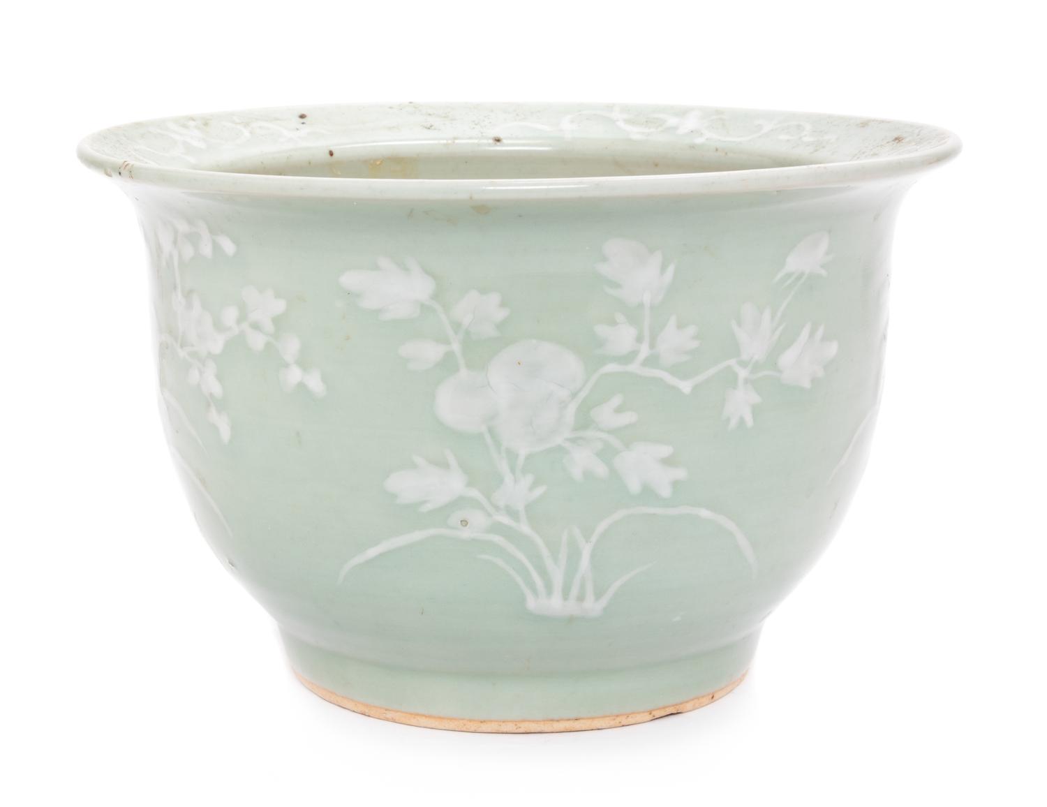 A Chinese White Slip Decorated Celadon Ground Cachepot Height 11 1/2 inches.