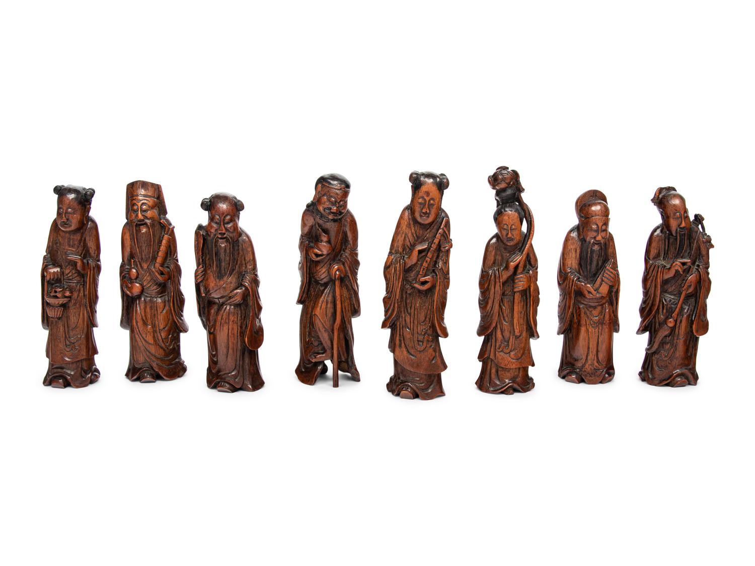 Eight Chinese Carved Hardwood Figures of the Daoist Immortals