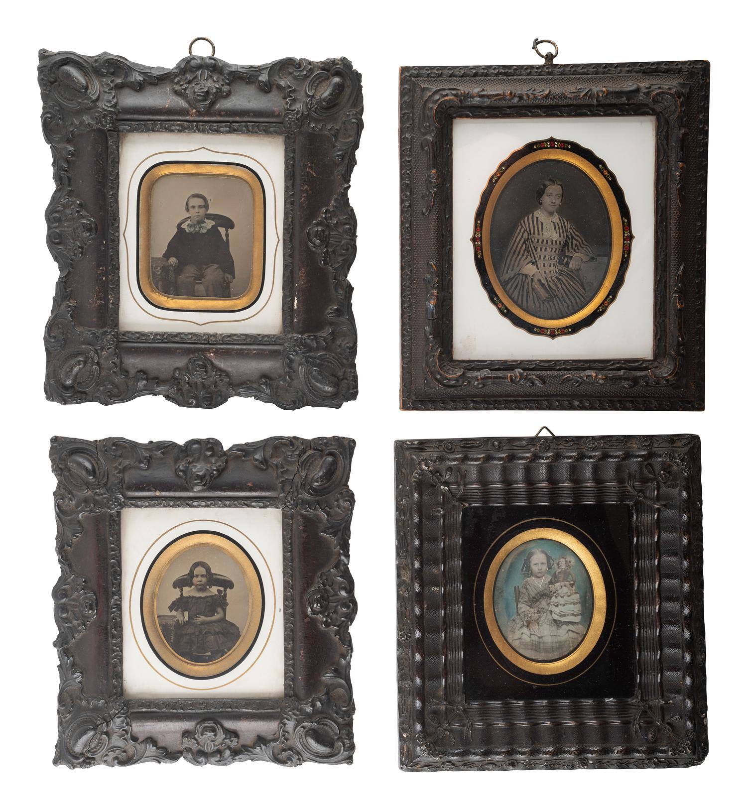 [EARLY PHOTOGRAPHY]. A group of 9 European portraits in wall frames, highlighted by attractive daguerreotypes of men, women, and children, including: