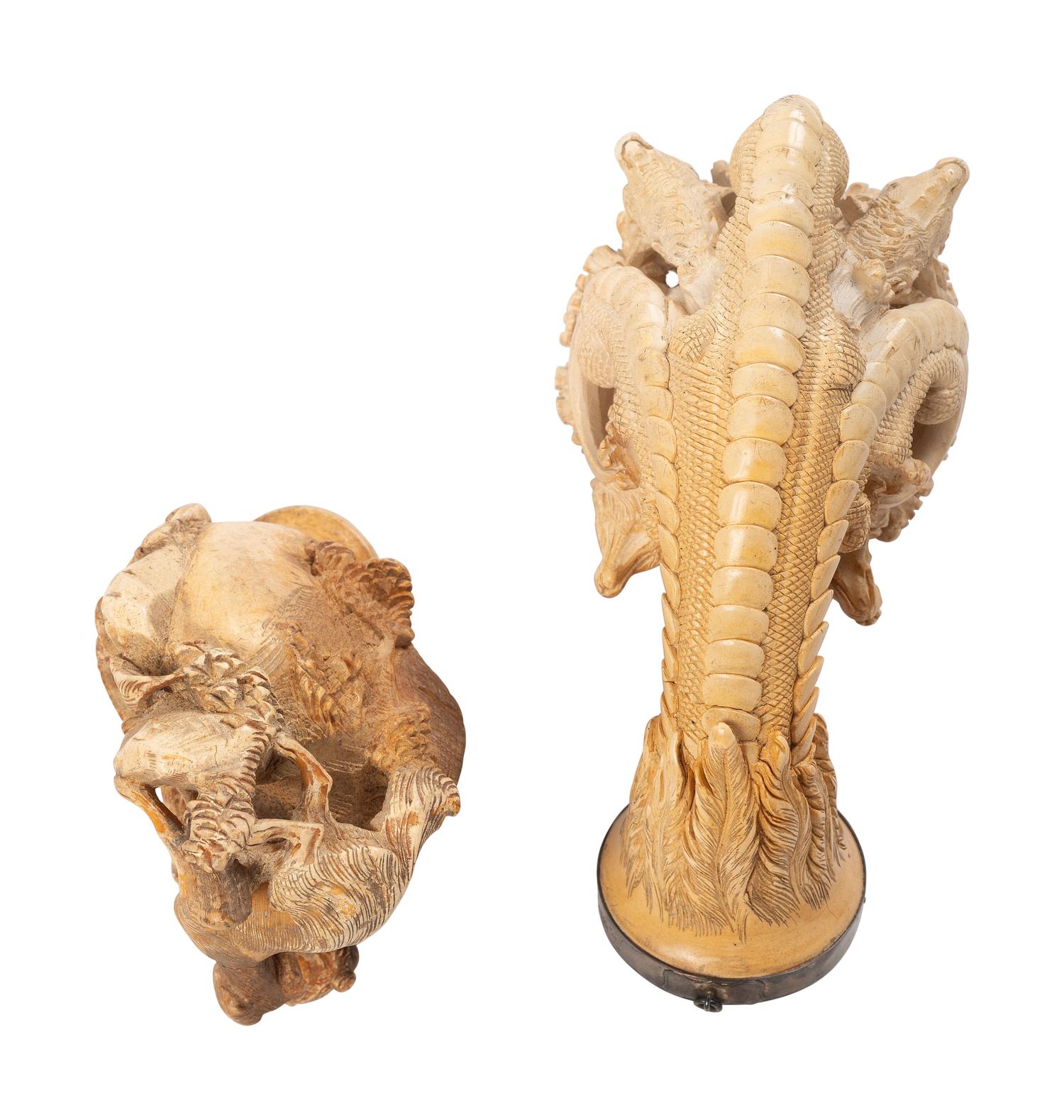 [AMERICANA - PIPES]. 2 ornately carved meerschaum pipes, each featuring animal motifs.