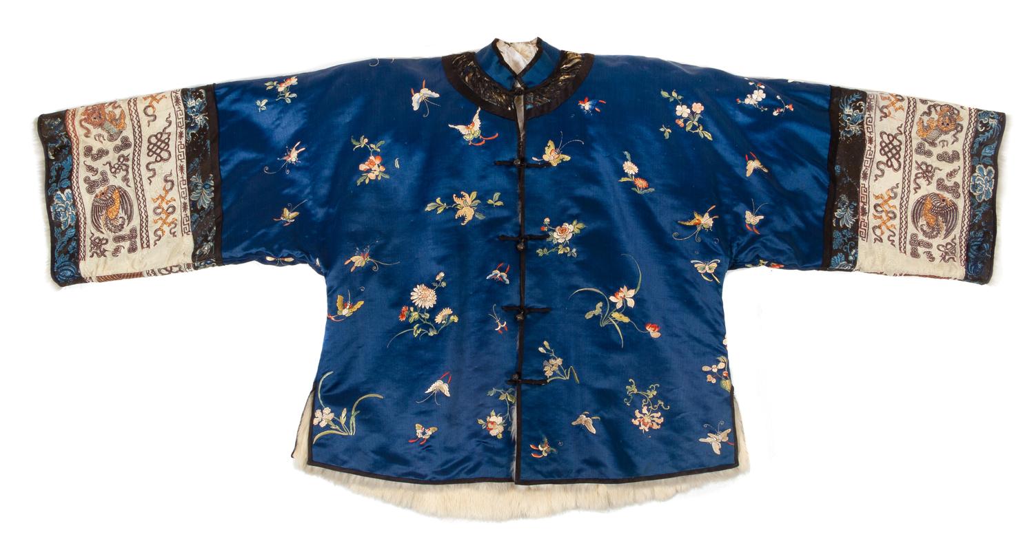 An Embroidered Silk Blue Ground Lady's Winter Jacket Height collar to hem 27 inches. — 19TH CENTURY