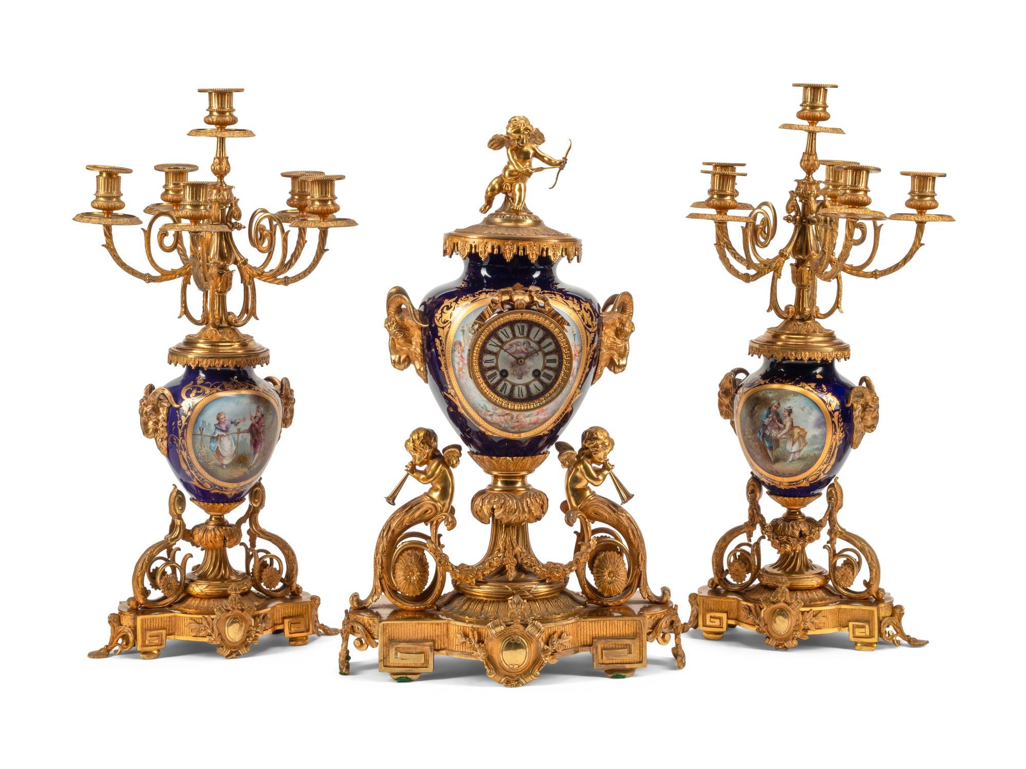 A Louis XVI Style Gilt Bronze and Sèvres Style Porcelain Clock Garniture