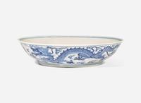 A Chinese blue and white porcelain "Dragon" dish, Jiaqing mark and of the period 青花雲龍紋盤 嘉慶款 清 嘉慶