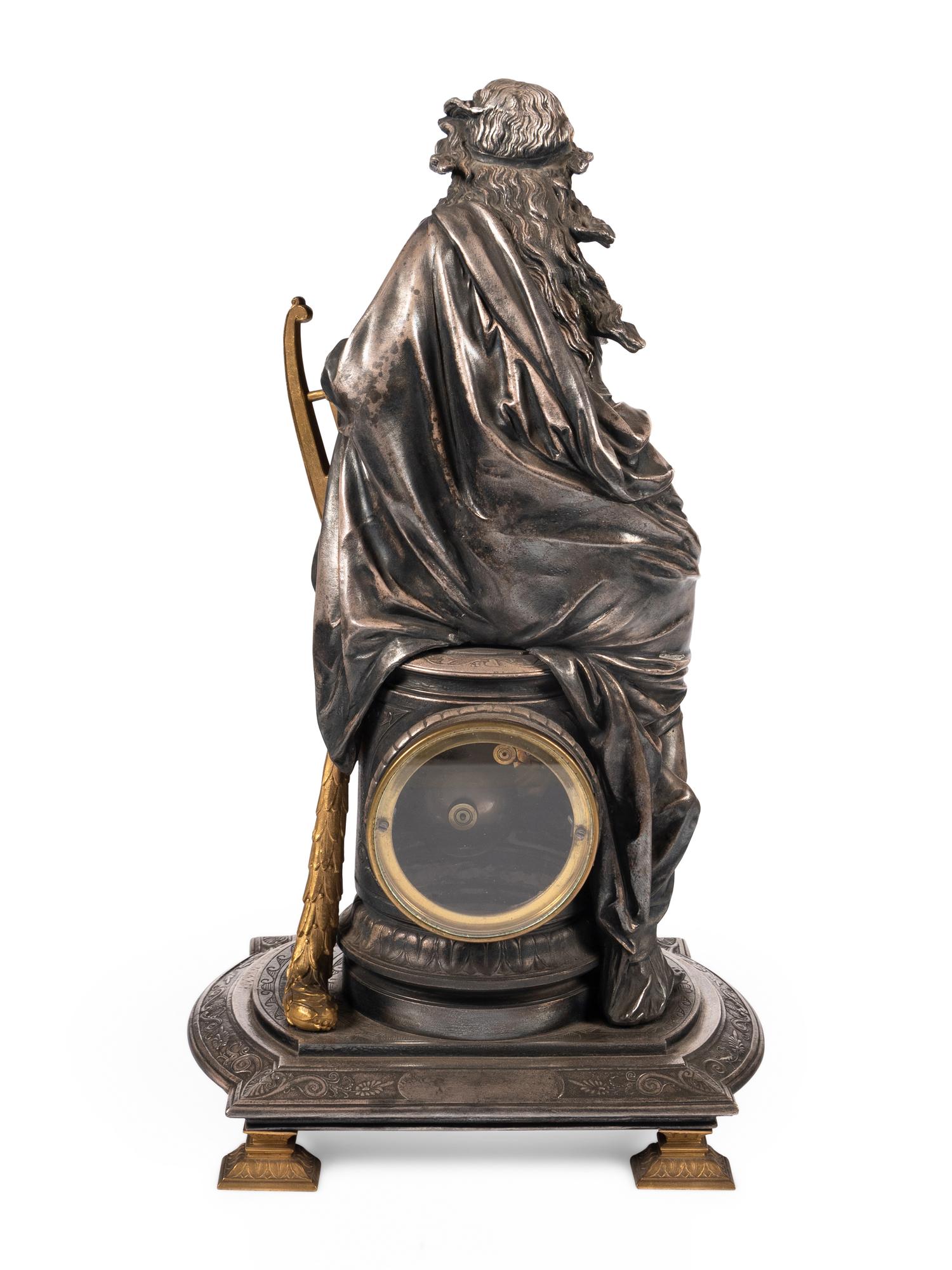 A French Gilt Bronze and Cast Metal Figural Clock