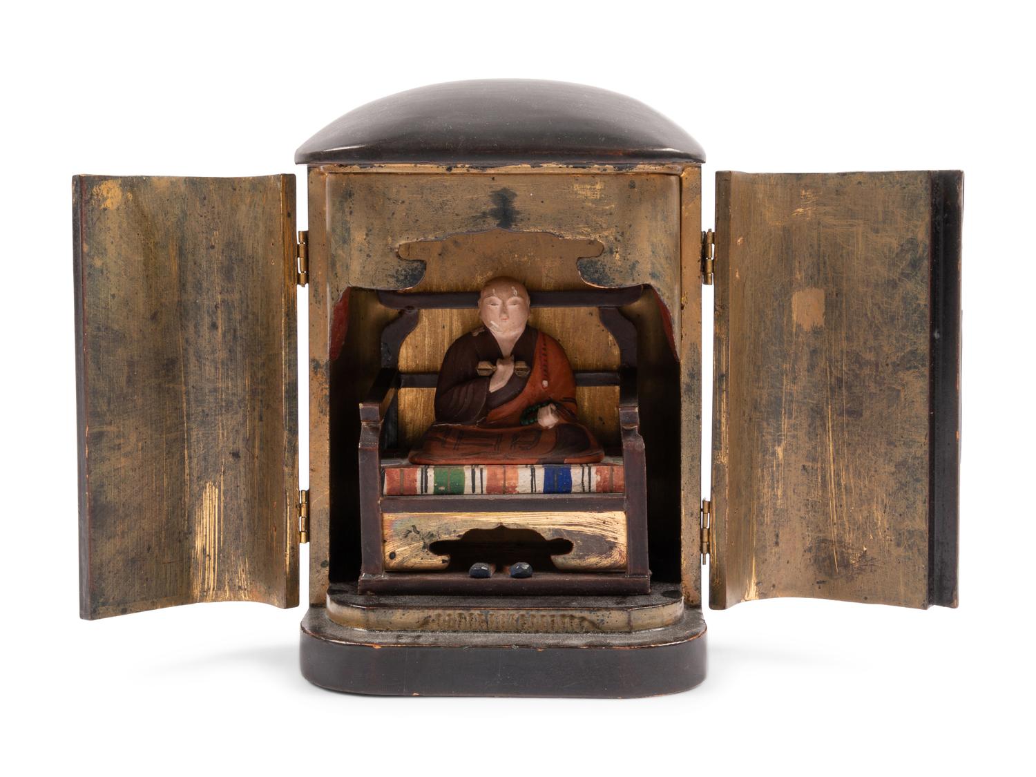 A Japanese Gilt and Black Lacquer Traveling Shrine with A Painted Figure of Buddha