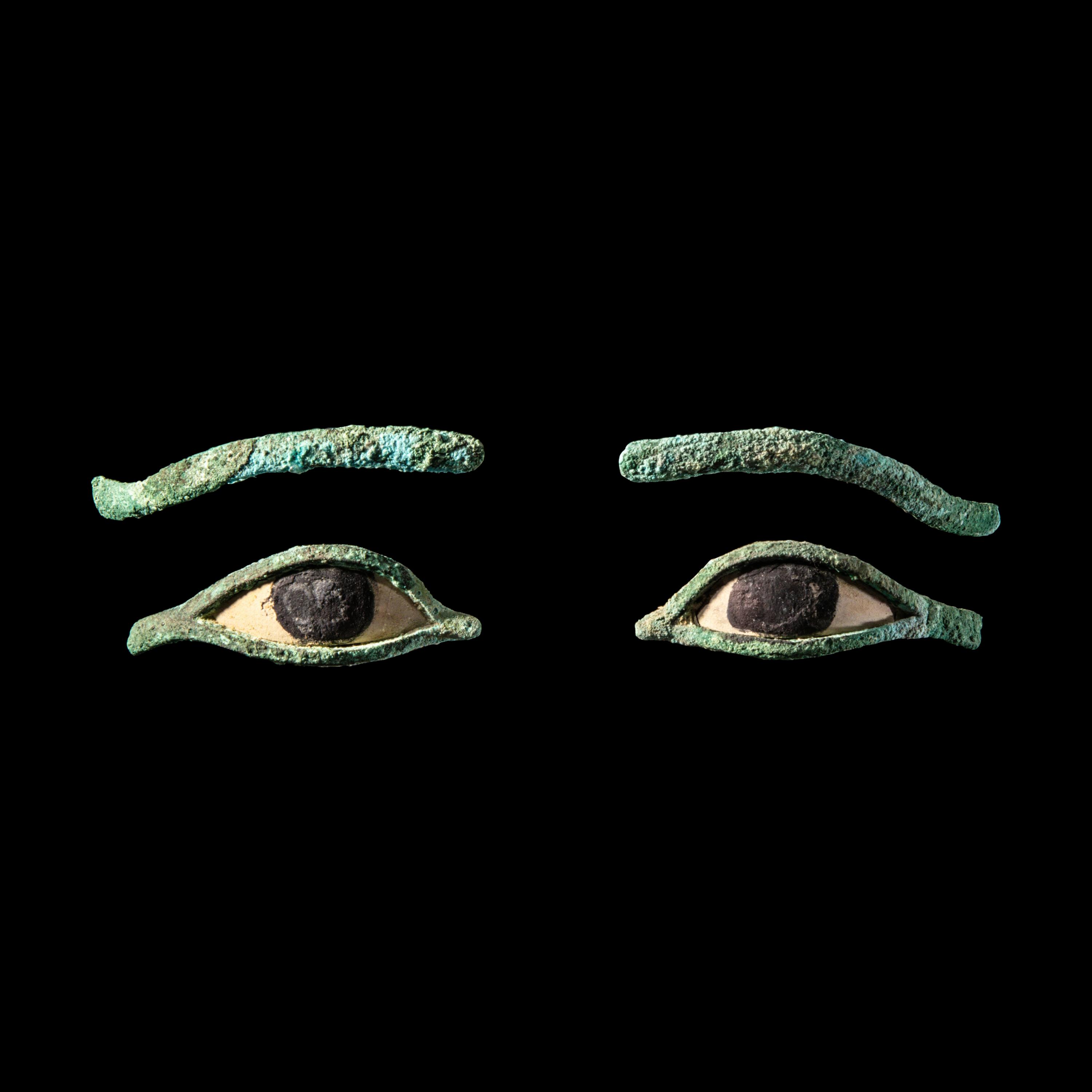 A Pair of Egyptian Bronze Eye Inlays