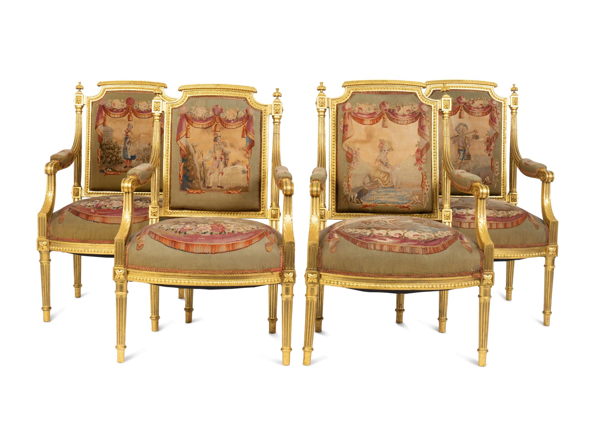 A Set of Four Louis XVI Style Giltwood Fauteuils with Tapestry Upholstery — 19TH CENTURY