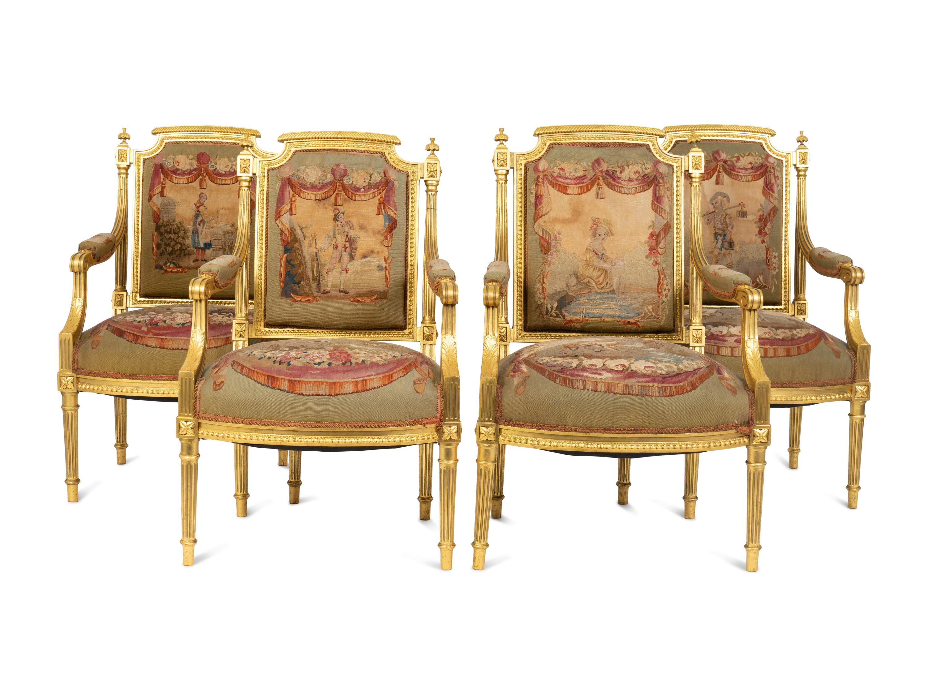A Set of Four Louis XVI Style Giltwood Fauteuils with Tapestry Upholstery — 19TH CENTURY