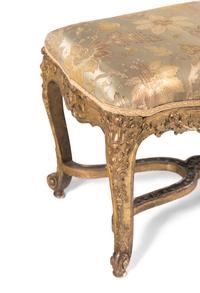 A Louis XV Carved Giltwood Window Bench