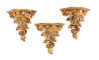 A Set of Three Italian Giltwood Brackets, Height 8 1/2 inches.