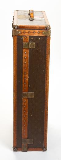 A Louis Vuitton Monogram Leather Wardrobe Trunk, 33.5"H x 21.25"W x 9"D.