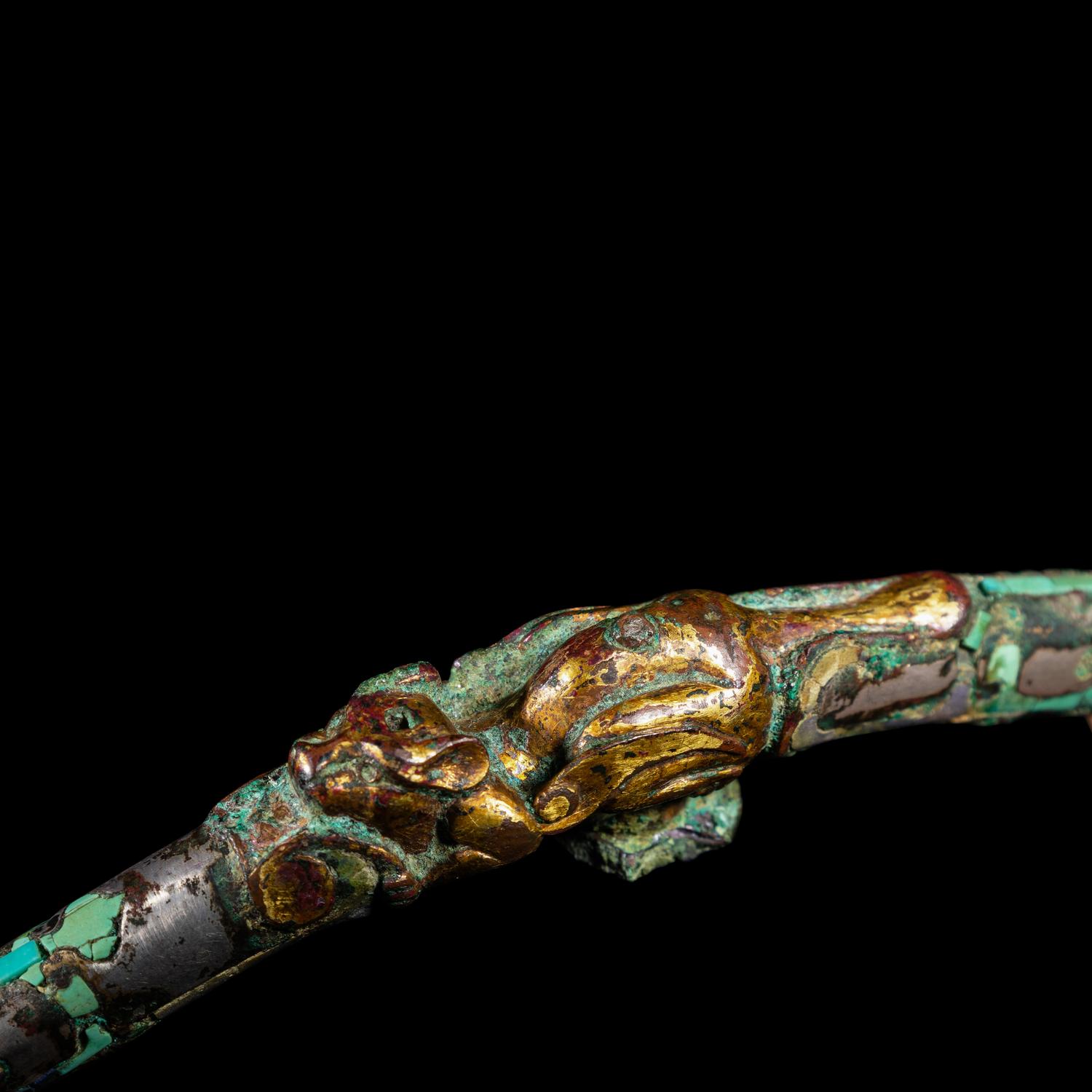 A Chinese Gilt, Silvered and Turquoise Inlaid Bronze Belt Hook, Warring States Period 戰國 銅 鎏金錯銀嵌松石雙獸首帶鉤