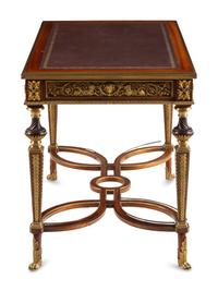 A Louis XVI Style Gilt Bronze Mounted Mahogany Writing Table