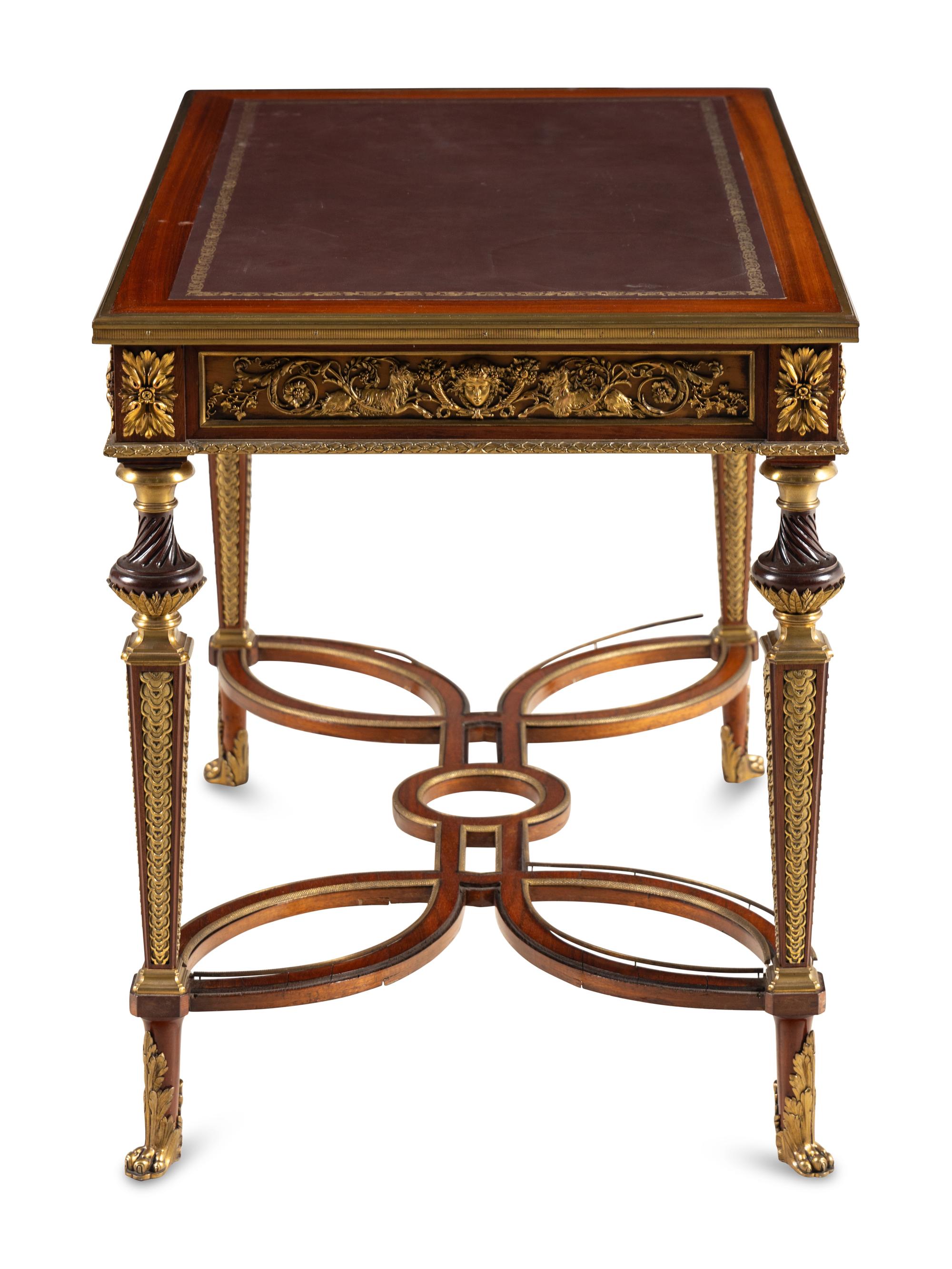 A Louis XVI Style Gilt Bronze Mounted Mahogany Writing Table