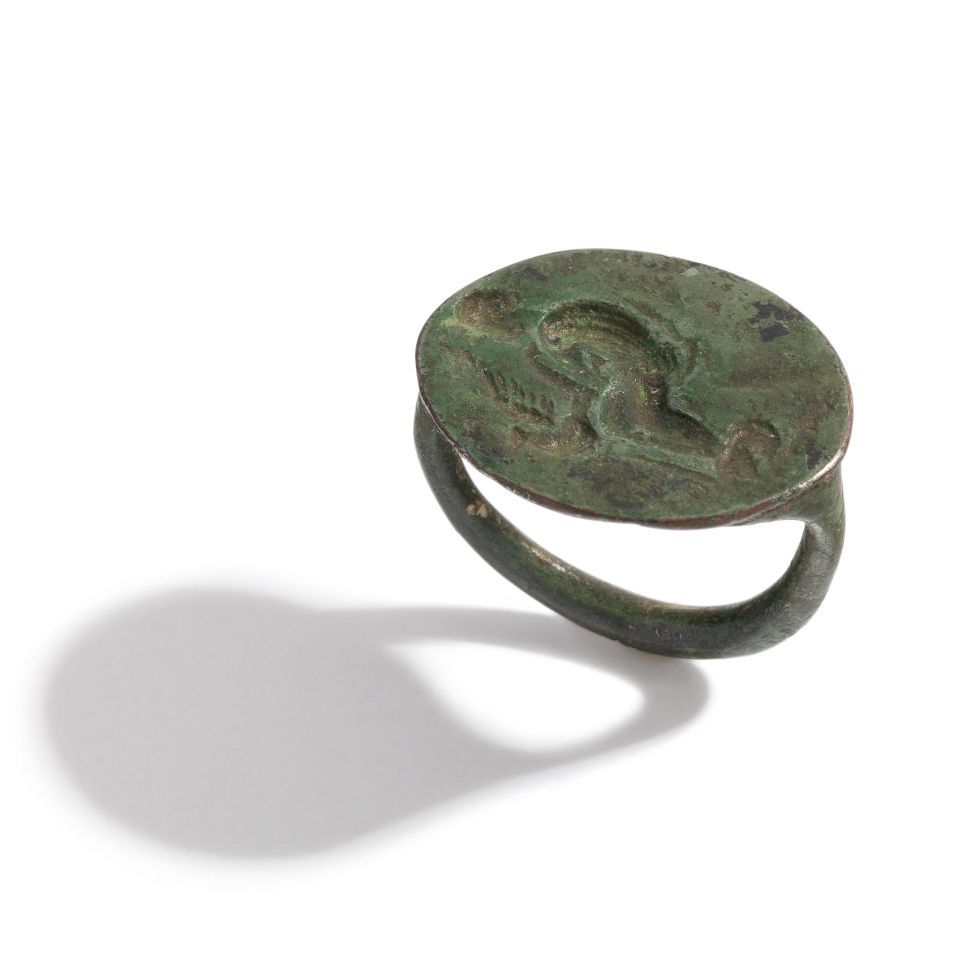 A Greek Bronze Finger Ring with Leda and the Swan or Aphrodite and her Dove