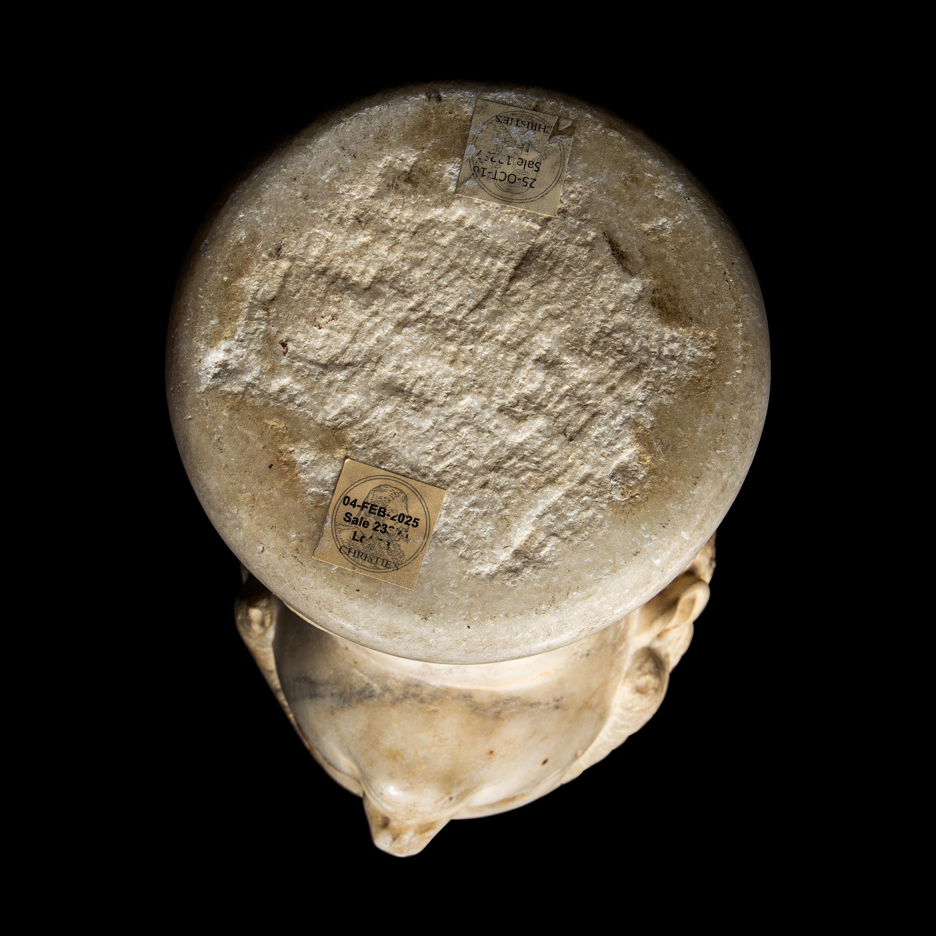A Roman Marble Archaistic Head of a Goddess