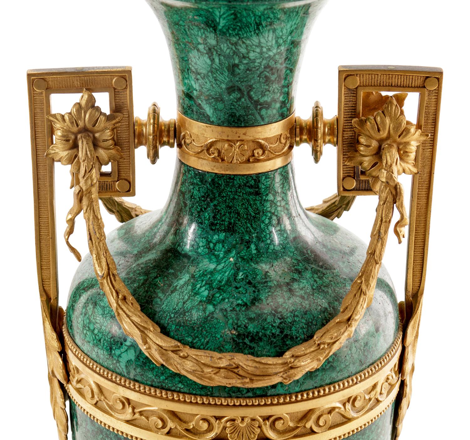A Louis XVI Style Gilt Metal Mounted Malachite Veneered Urn