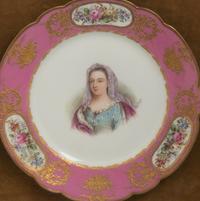 A Group of Seven Framed Sèvres Style Porcelain Plates