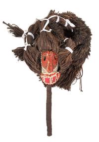 A Senufo Wood and Raffia Mask and Costume Length overall 102 inches. — 19TH/20TH CENTURY