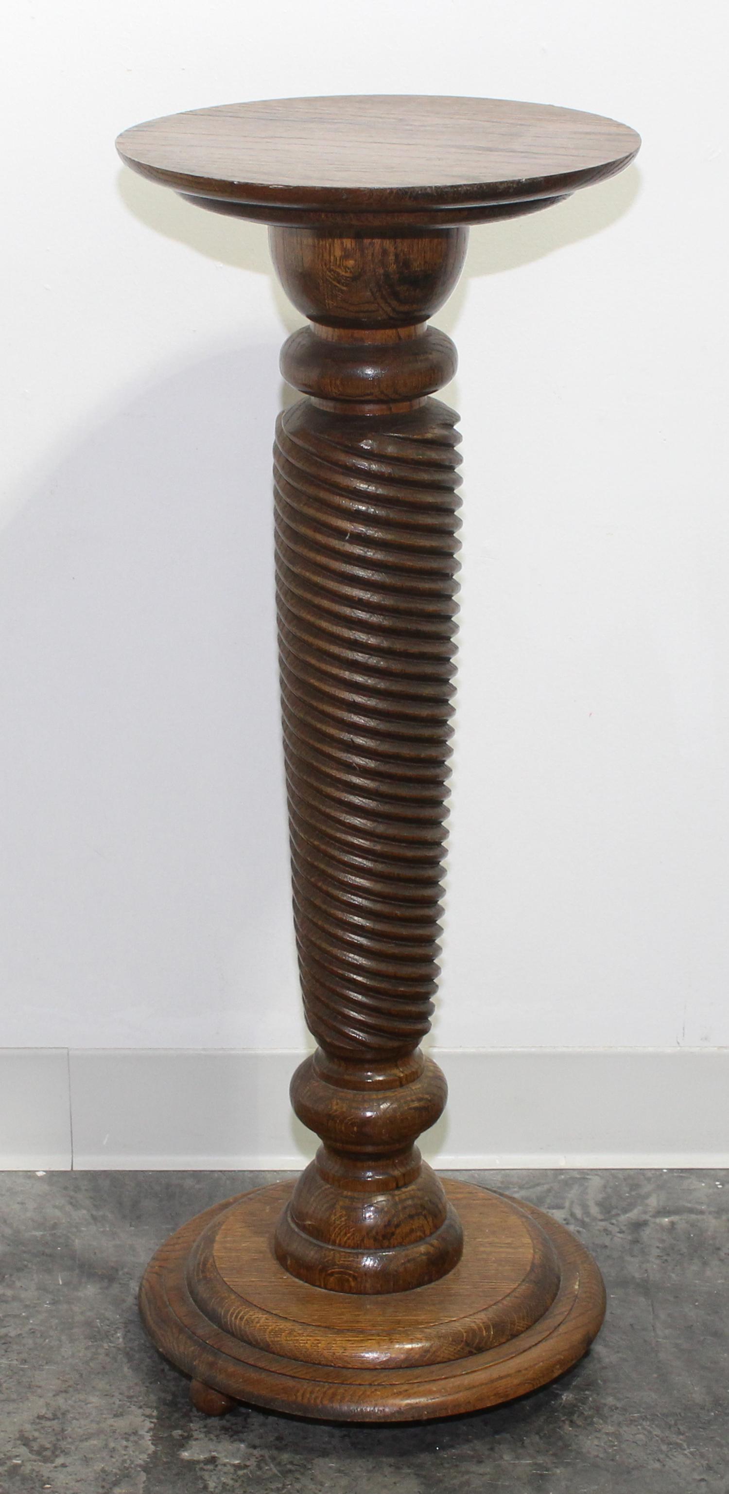 A Turned Oak Pedestal. Height 34 1/2 inches.