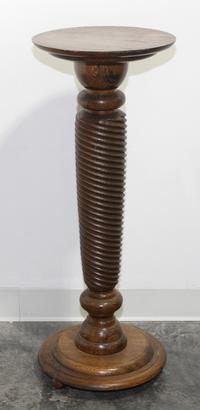 A Turned Oak Pedestal. Height 34 1/2 inches.