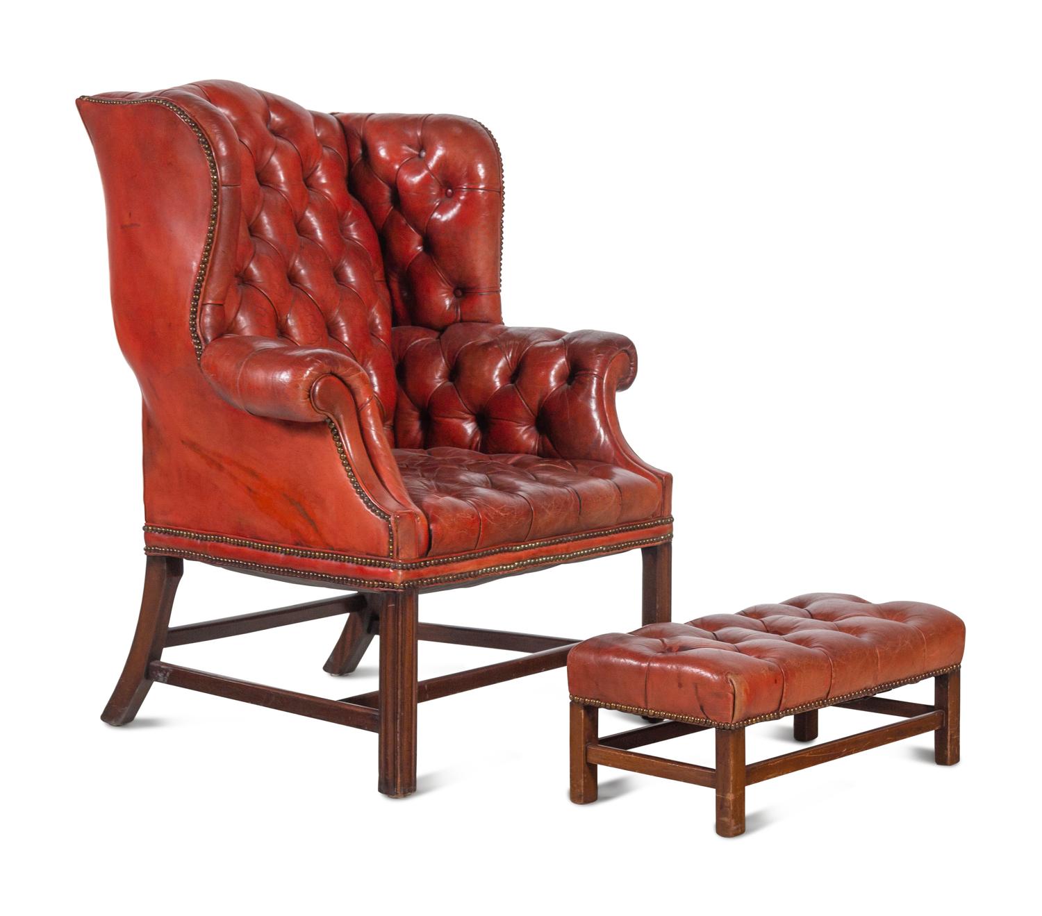 A Pair of Leather Wingback Armchairs with Ottoman