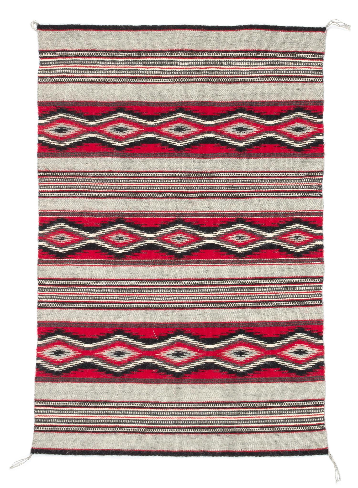 Three Navajo Rugs Length of largest 49 x width 32 1/2 inches.