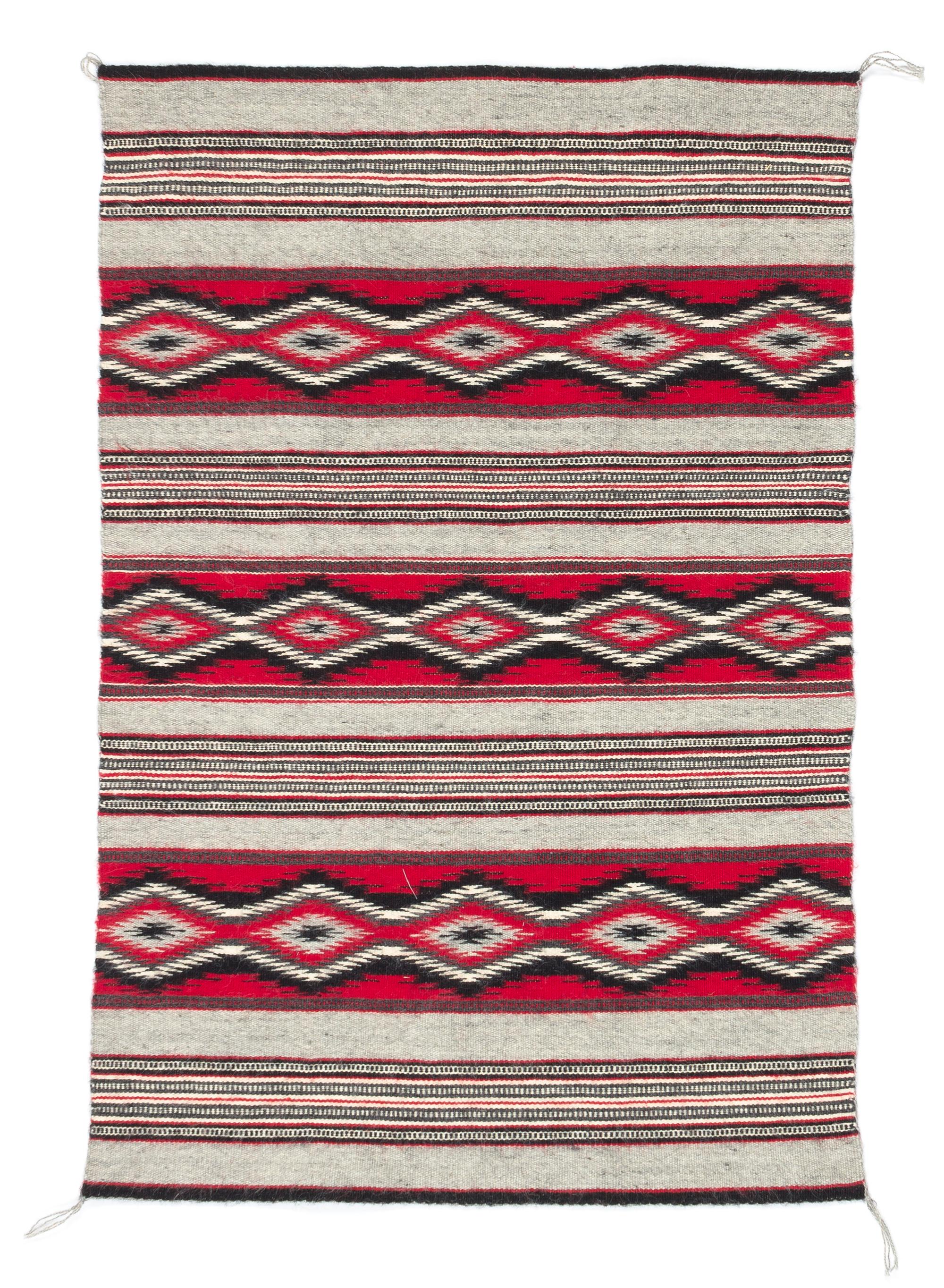 Three Navajo Rugs Length of largest 49 x width 32 1/2 inches.