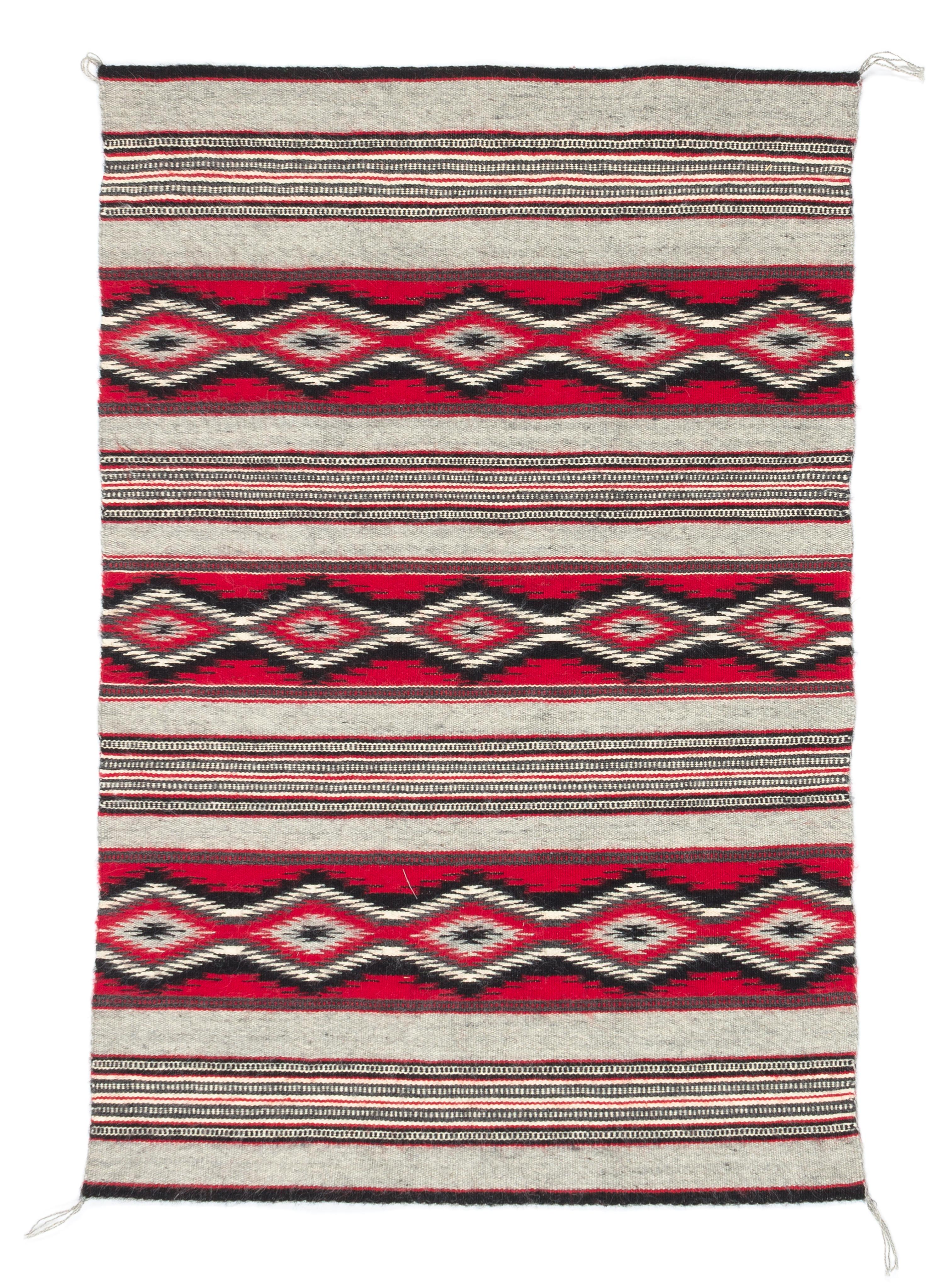 Three Navajo Rugs Length of largest 49 x width 32 1/2 inches.