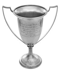 An American Silver Trophy, Chicago Silver Co., Chicago, IL, having two handles and raised on a trumpet form base, the body engraved wit