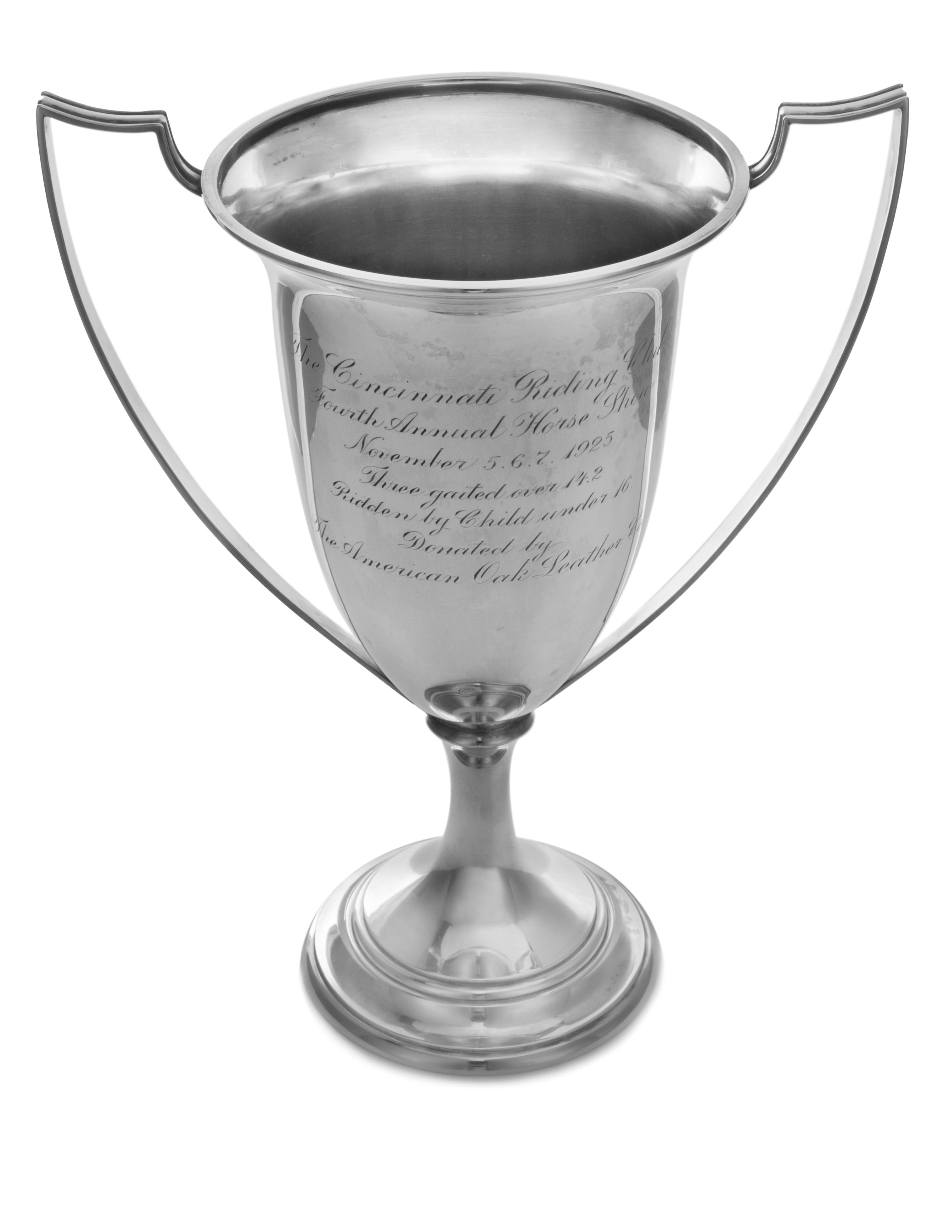An American Silver Trophy, Chicago Silver Co., Chicago, IL, having two handles and raised on a trumpet form base, the body engraved wit