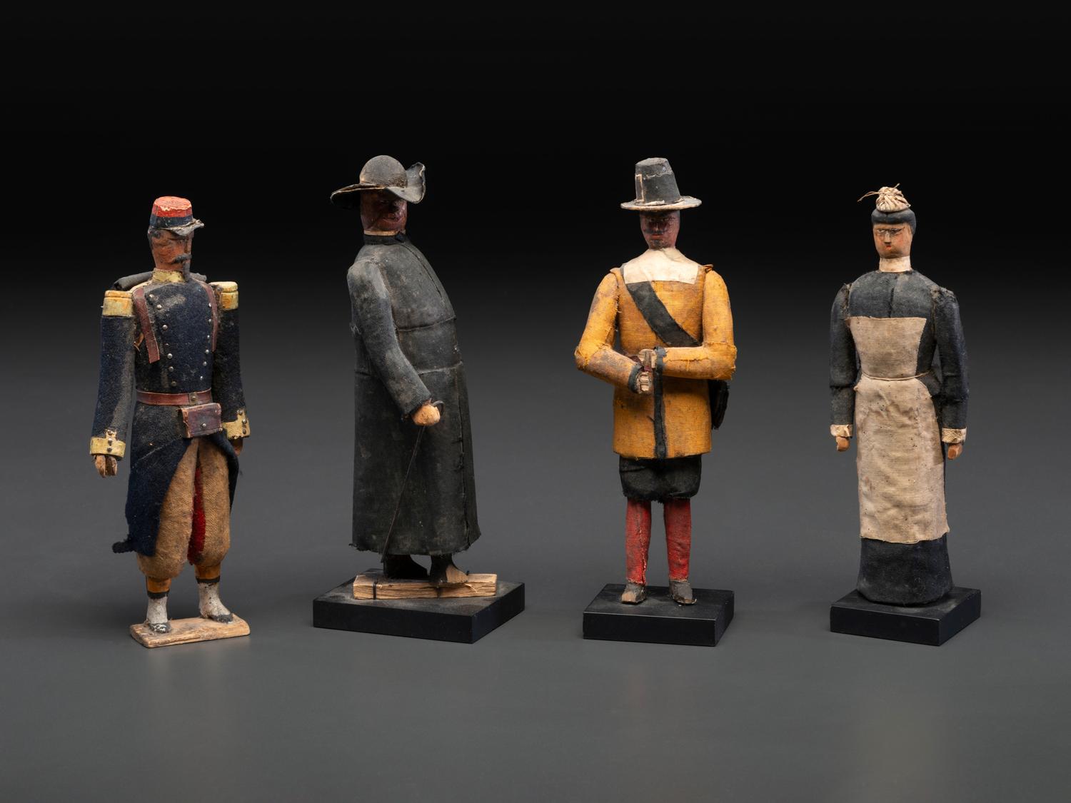 A Collection of Folk Art Carved and Painted 'English Parade' Figures